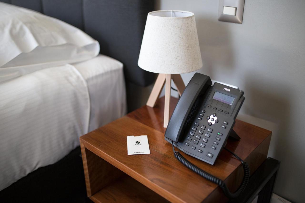 Hotel Enjoy Pucon Exterior photo A Grandstream GXP2170 VoIP phone